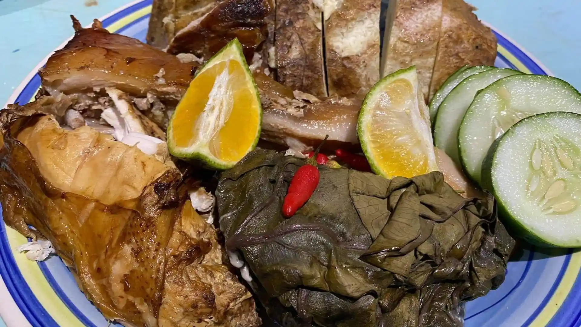 Tourists participating in a traditional Fijian lovo underground cooking experience