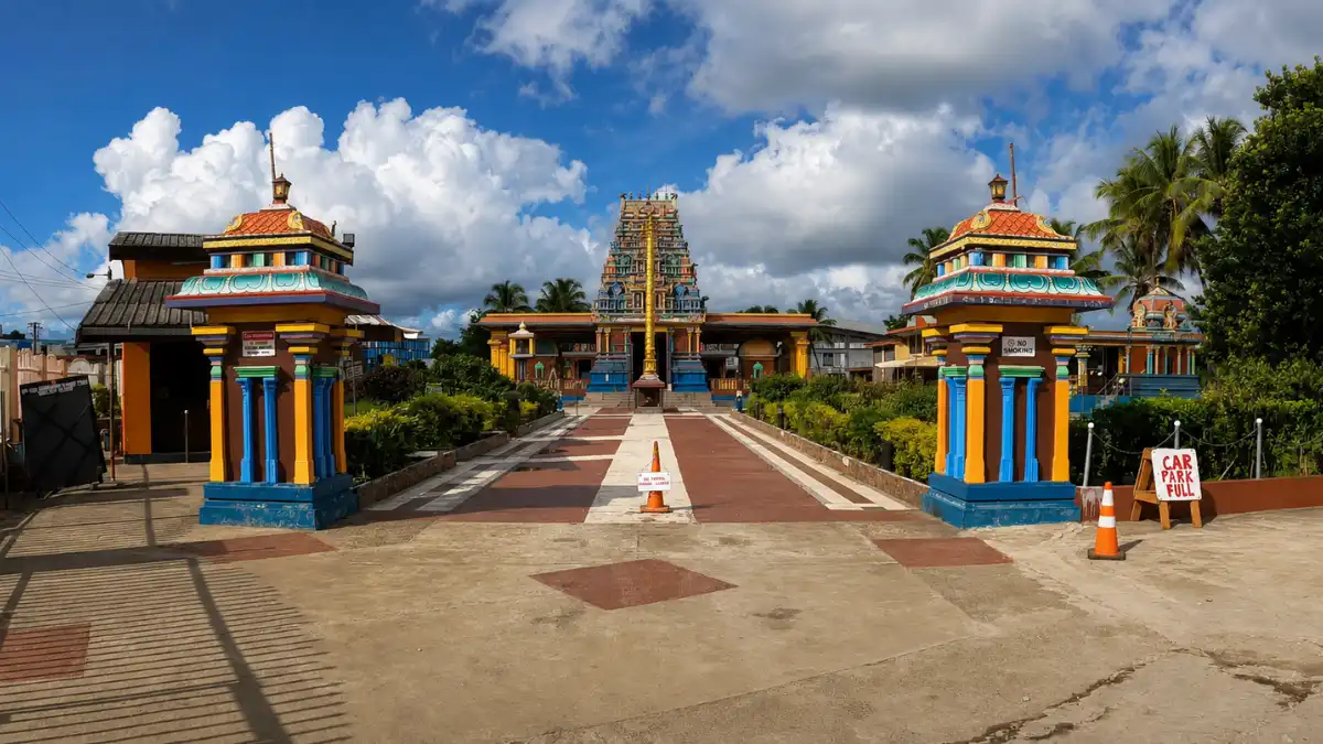 Sri Siva Subramaniya Temple in Nadi, Fiji, with colourful Dravidian architecture against a tropical sky.