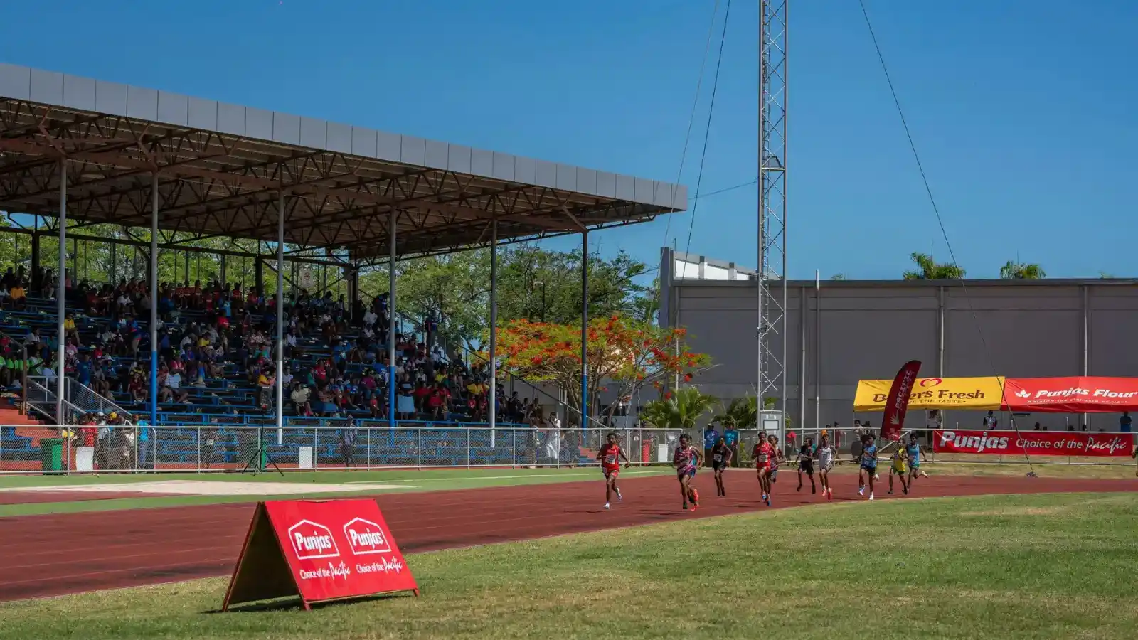 Packed Churchill Park stadium during rugby match in Lautoka Fiji with 18,000 passionate fans cheering under floodlights