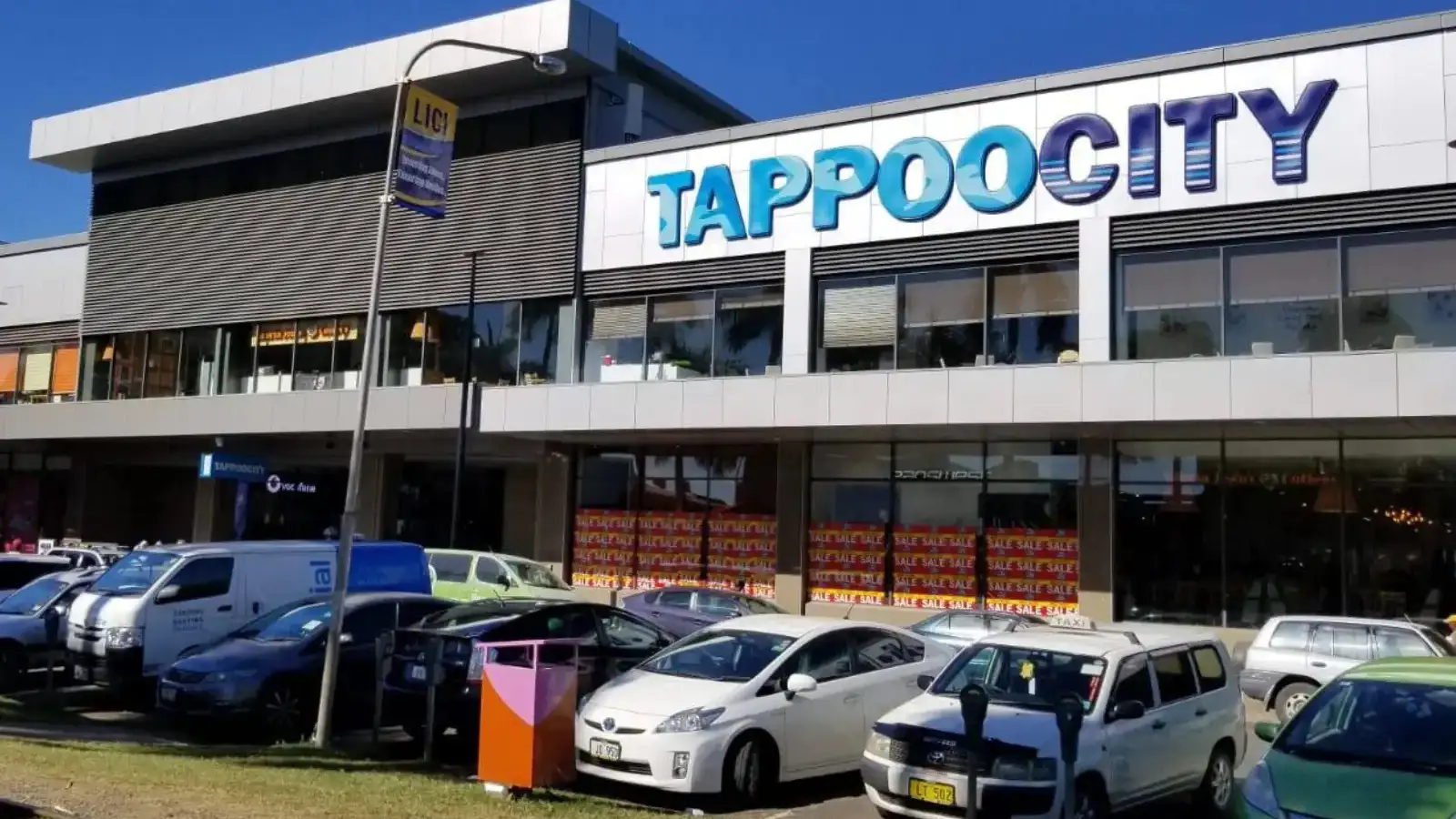 Interior of Tappoo Mall Market handicraft section in Lautoka showing vendors displaying traditional Fijian wood carvings baskets and souvenirs in air-conditioned mall setting