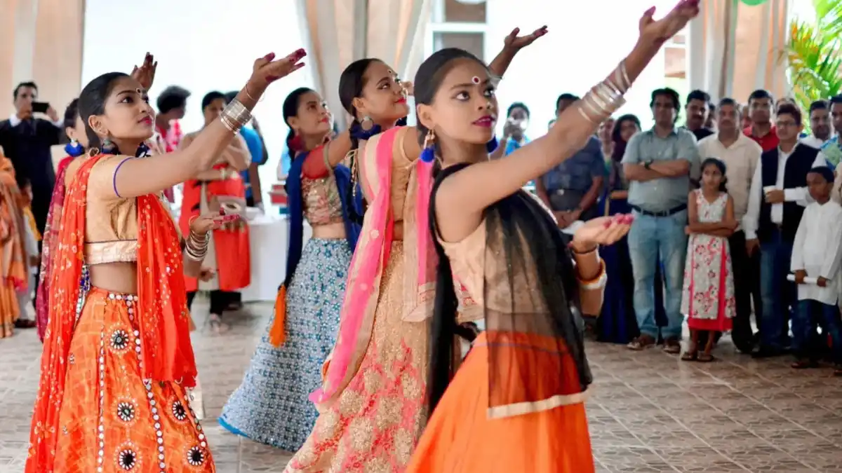 Dancers performing in colorful costumes on stage