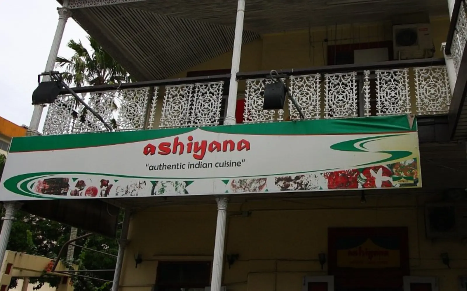A vibrant Indian curry or dish served in the colorful interior of Ashiyana Indian Restaurant in Suva, Fiji.