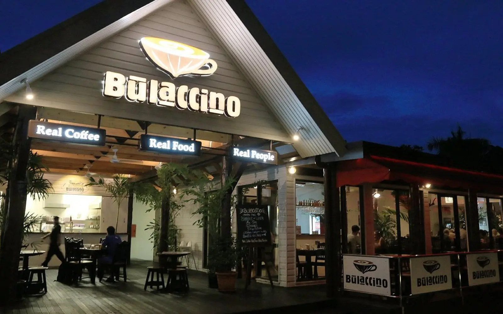 The inviting exterior of Bulaccino Cafe in Nadi, Fiji, showcasing its modern and eco-friendly building design.