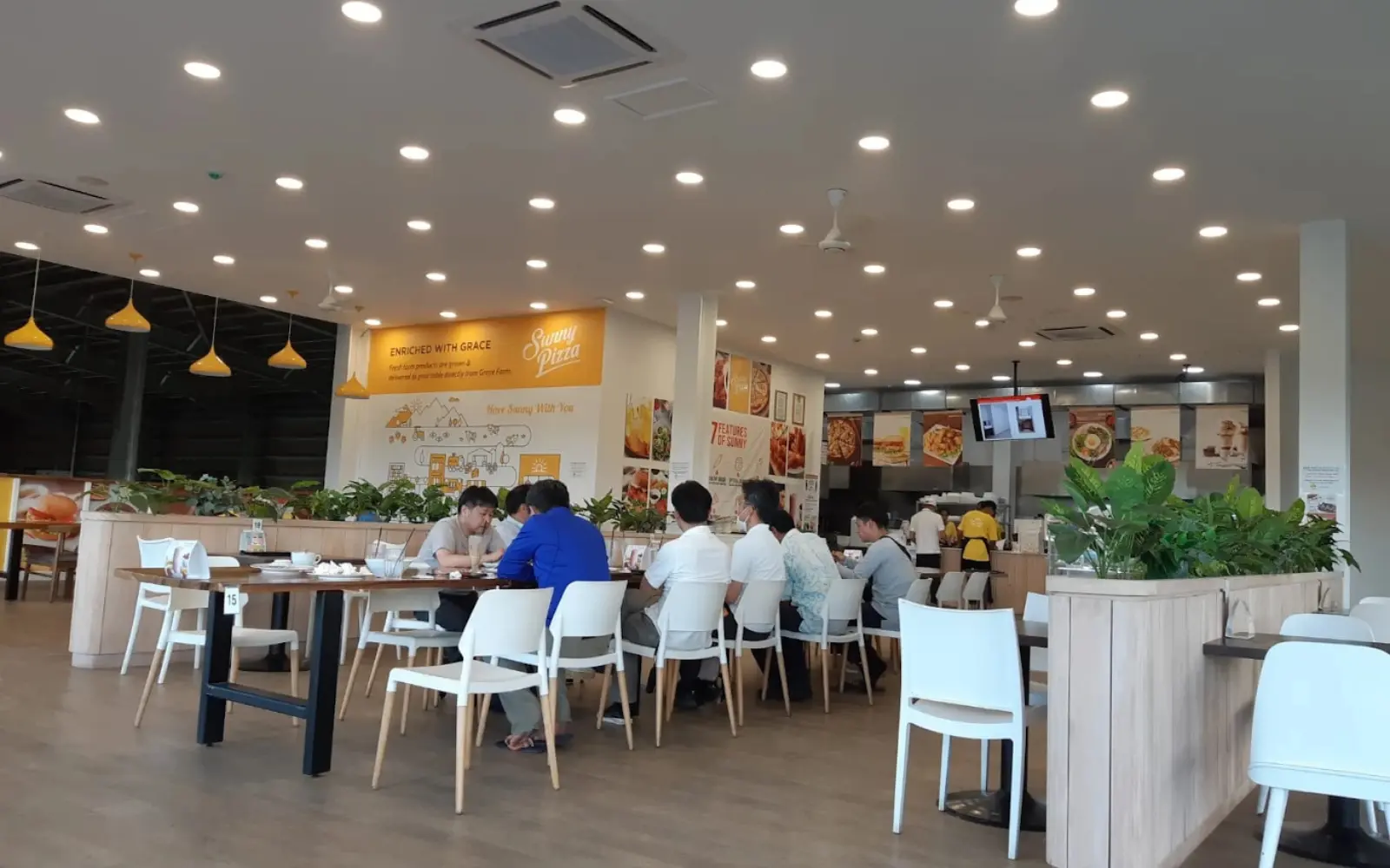 The spacious and modern dining interior of Grace Road Kitchen in Nadi, designed with a focus on natural light and comfortable seating.