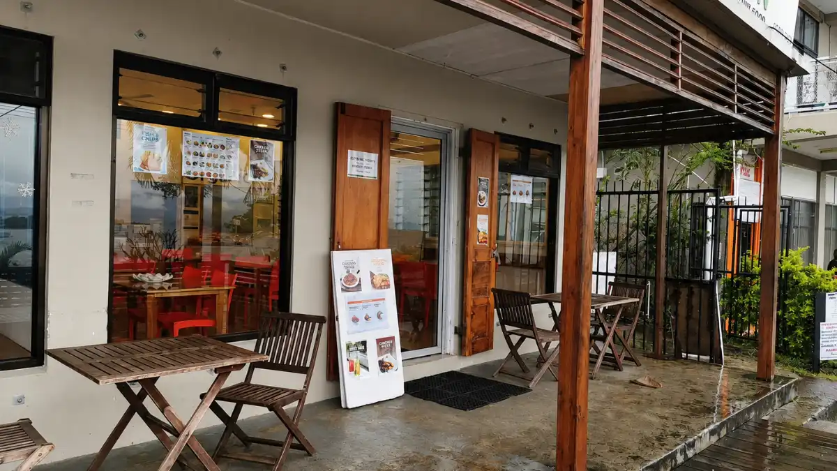Covered outdoor seating and entrance at Grace Kitchen in Savusavu