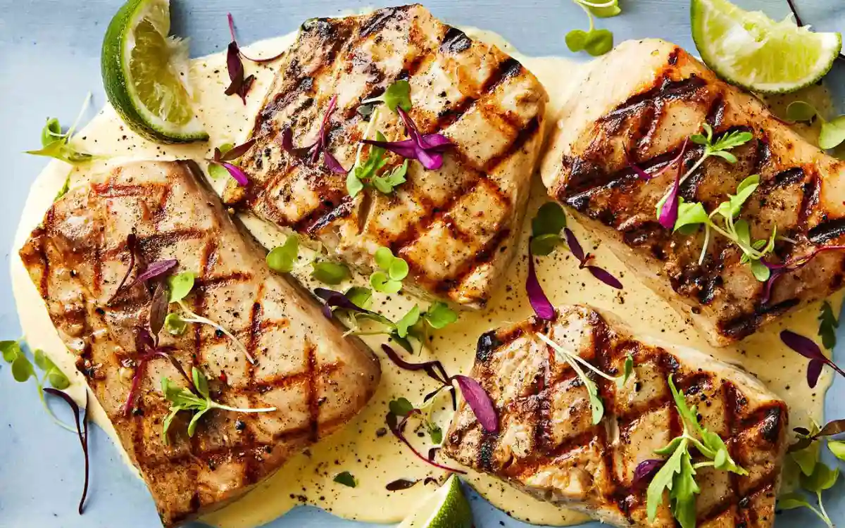 Beautifully plated grilled mahi-mahi with colorful tropical salsa at a Savusavu restaurant