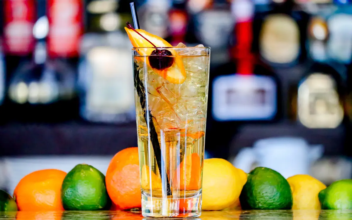Colorful tropical cocktails and mocktails served in fresh coconuts with pineapple garnish at Savusavu beach bar