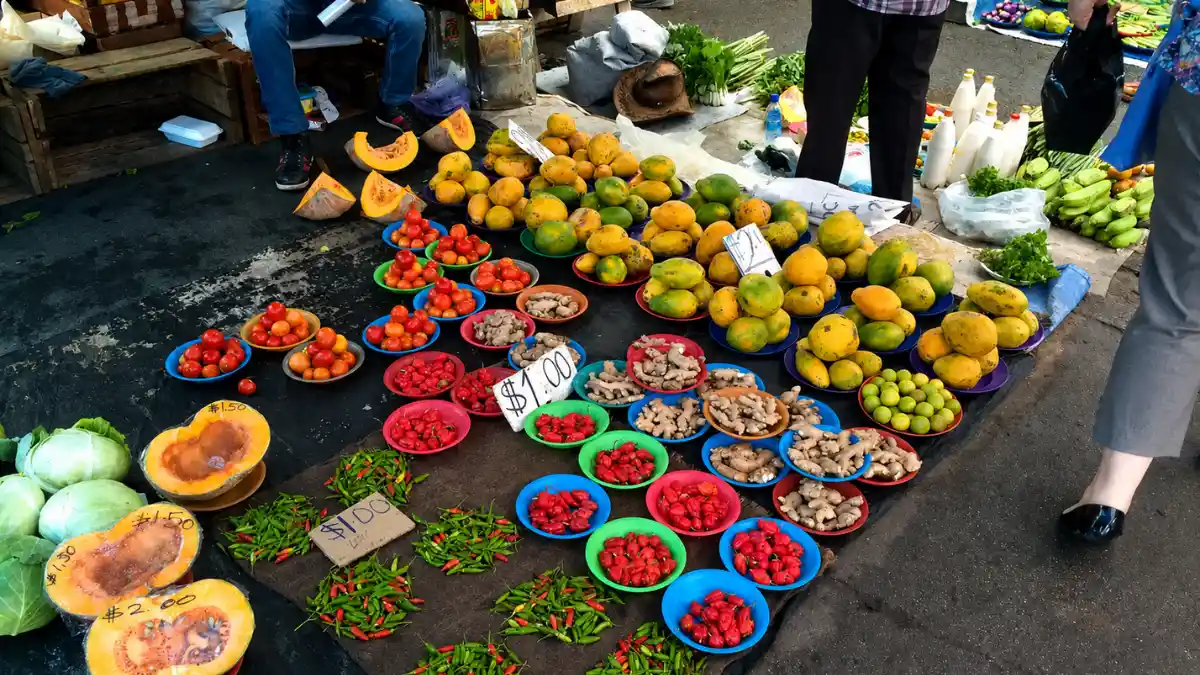 Papayas, ginger, chillies and vegetables displayed at a produce stall in Lautoka Market