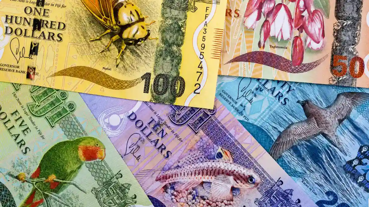 Old-design Fijian dollar banknotes in several denominations laid side by side