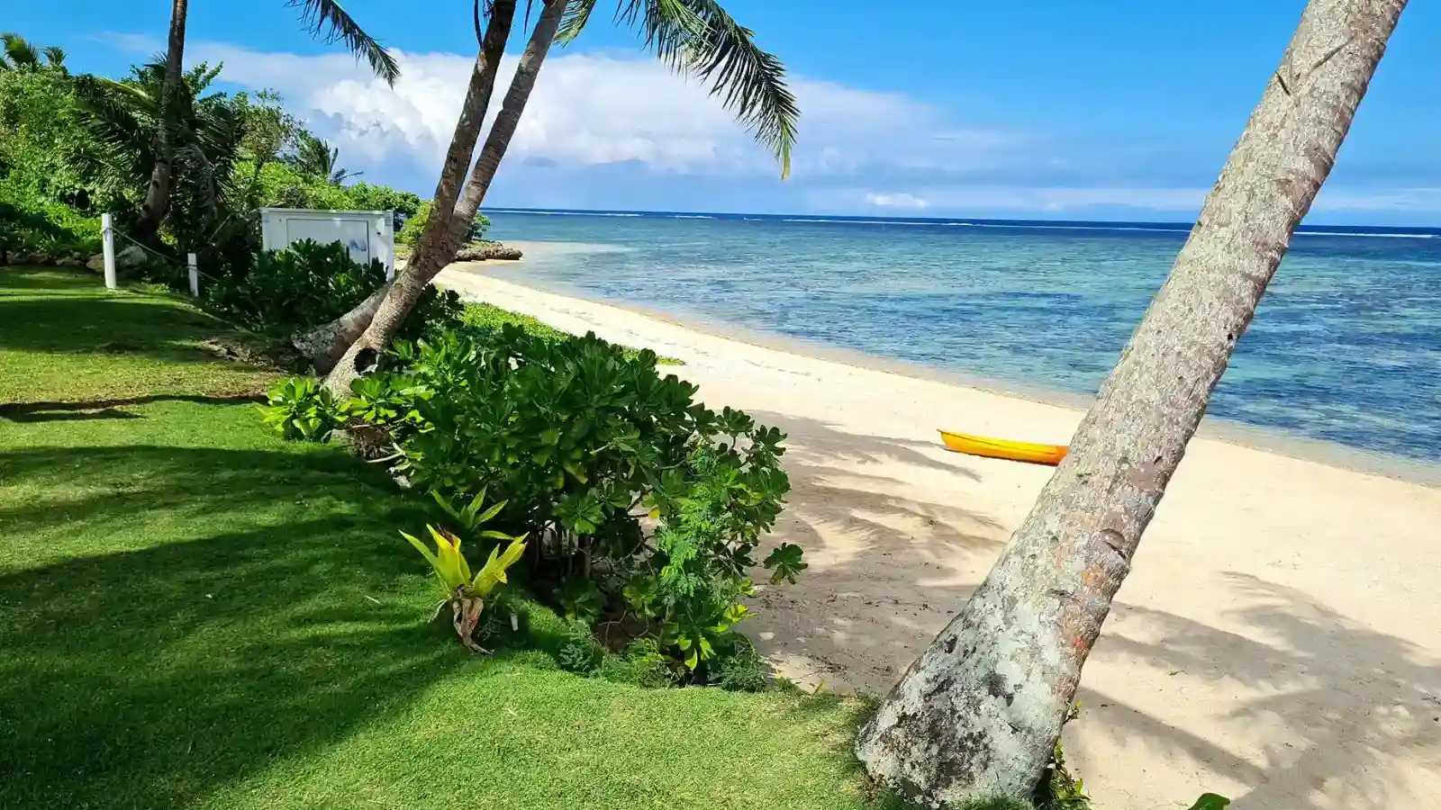 Clear sunny weather over Sigatoka’s Coral Coast with turquoise water, gentle waves, and bright skies typical of Fiji’s dry season