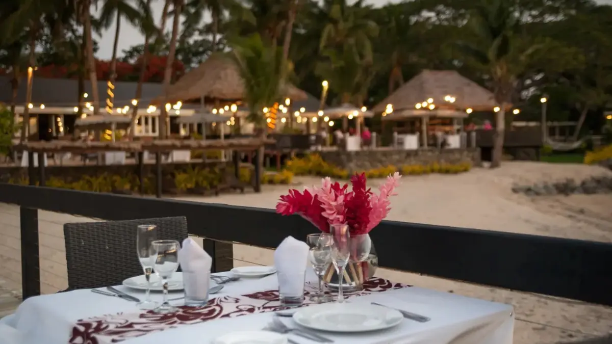 Beachfront dining tables at First Landing Beach Resort on Nalamu Beach, Vuda Point, Fiji