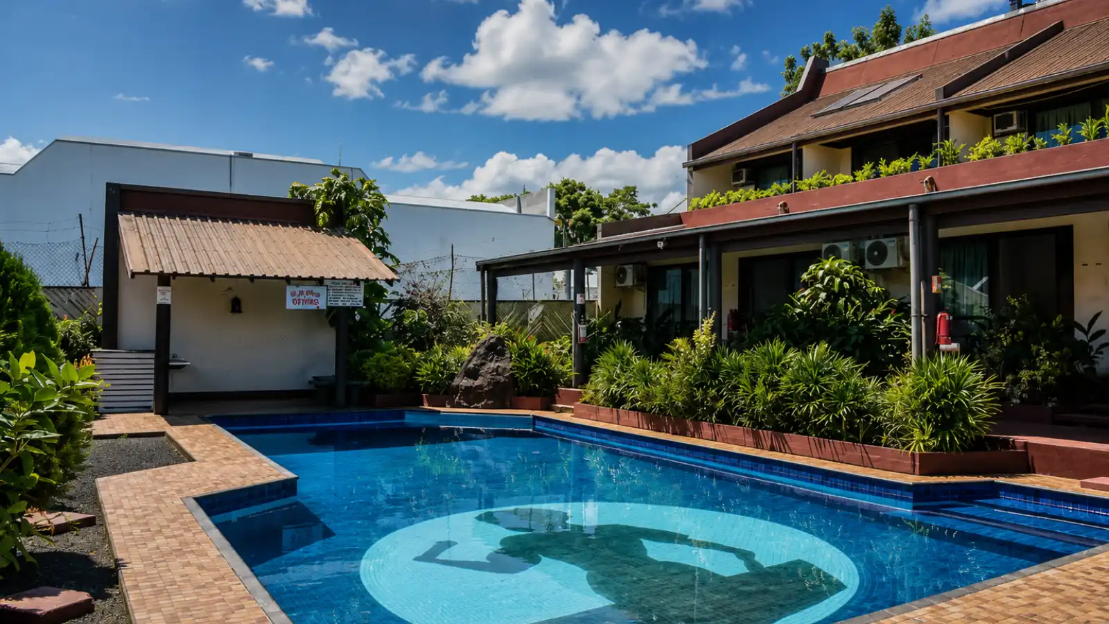 Outdoor swimming pool and courtyard at Lautoka Hotel in Fiji