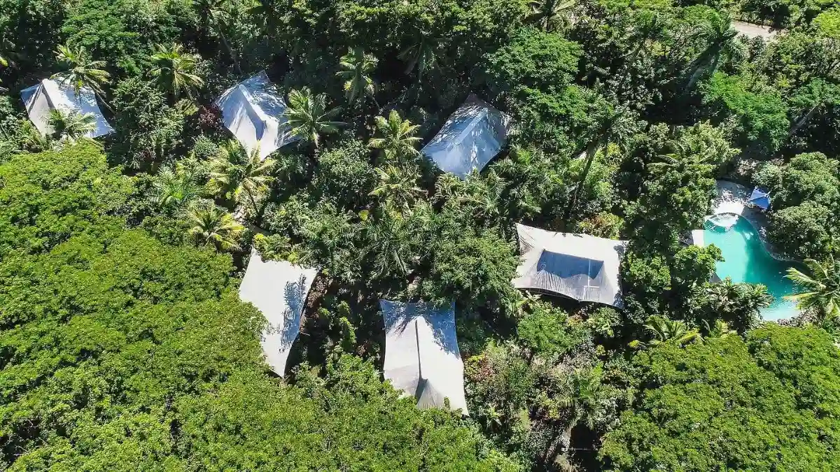 Tented garden bure at The Fiji Orchid surrounded by tropical plants in Lautoka, Fiji
