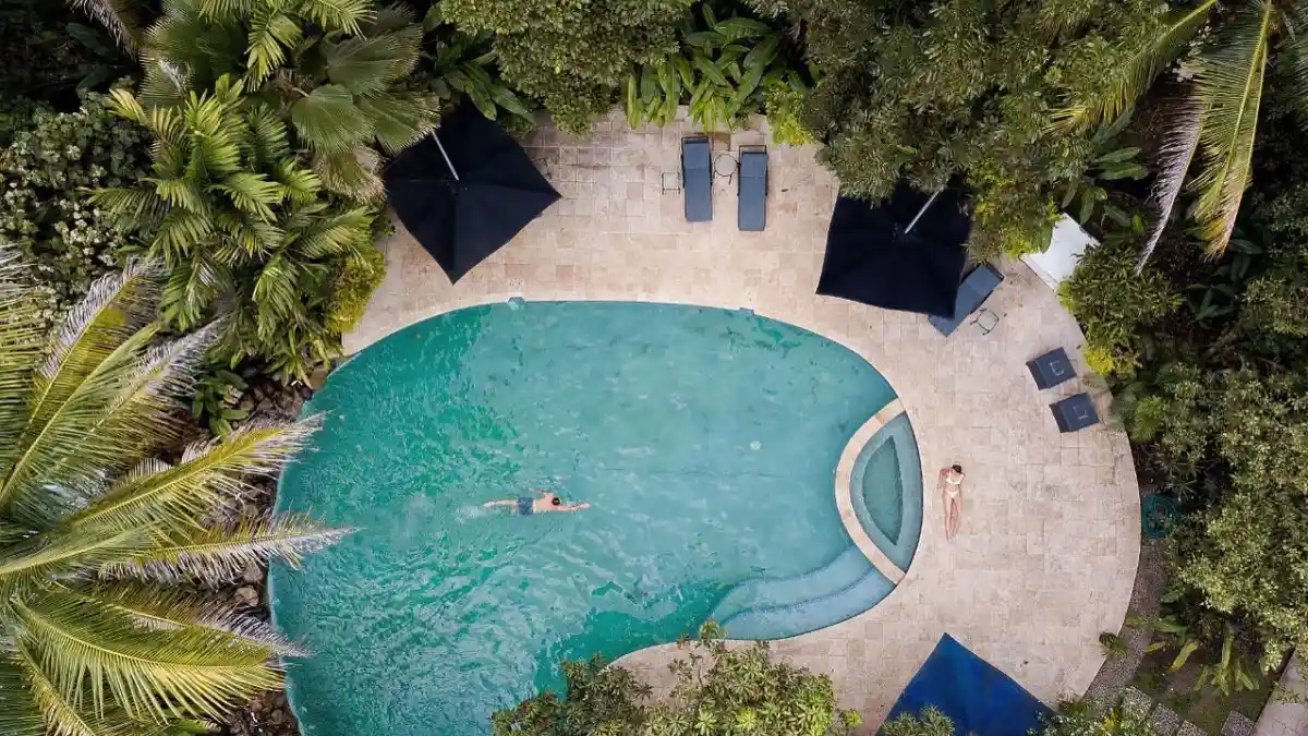 Garden swimming pool at The Fiji Orchid surrounded by tropical plants near Lautoka, Fiji