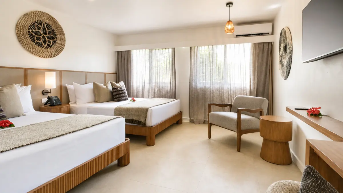 Deluxe guest room with king bed and timber finishes at Fiji Gateway Hotel