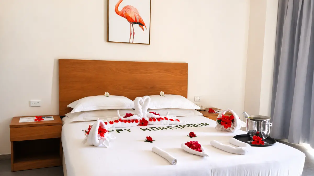 Guest room with a neatly made bed at Nalagi Hotel in Nadi.