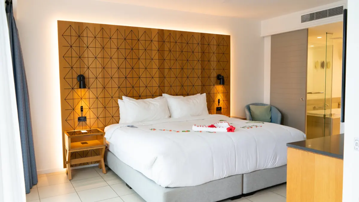 Living and dining area inside a one-bedroom suite at Radisson Blu Resort Fiji