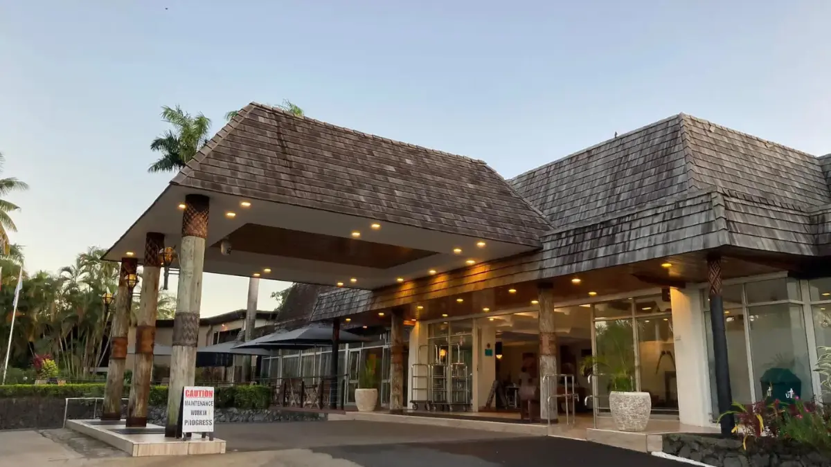 Outdoor pool and guest-room buildings at Tanoa International Hotel in Nadi.