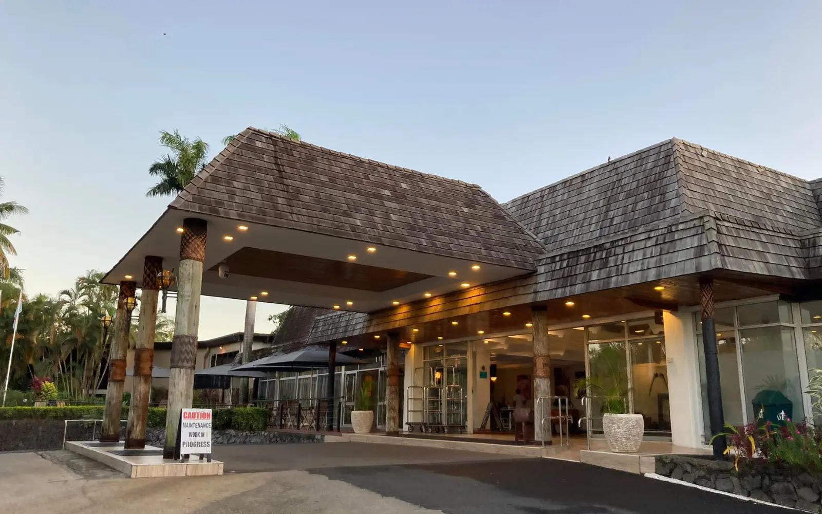 The exterior of Tanoa International Hotel in Nadi, Fiji, showcasing its modern design and tropical pool area, conveniently located near the airport.