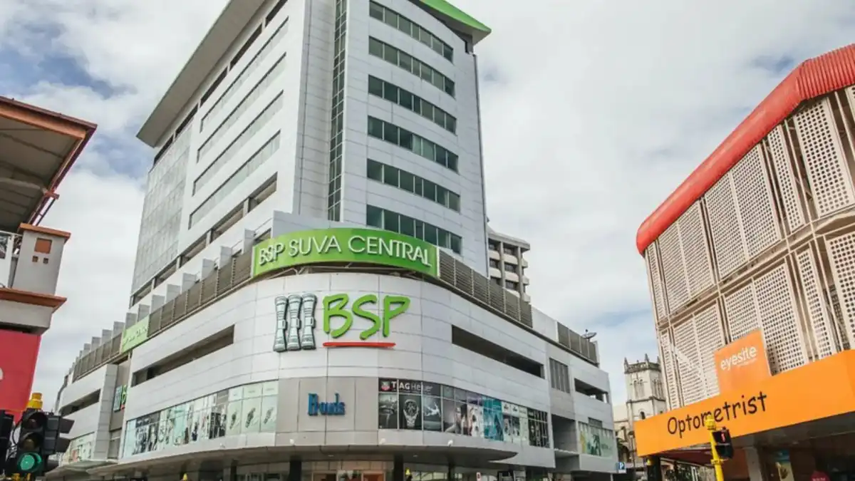 Serviced apartment living area and kitchen at Quest Suva.