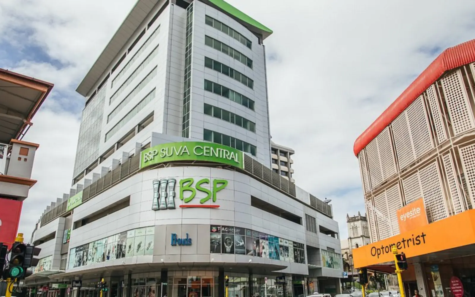 Modern and spacious serviced apartment living area with a fully equipped kitchen at Quest Apartments Suva, ideal for long stays.