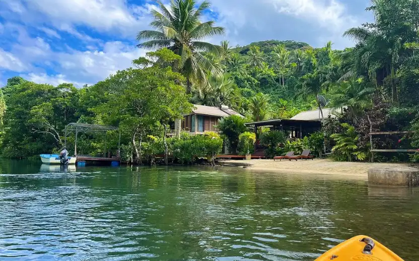Salt Lake Lodge bungalow overlooking tidal river and mangroves in Savusavu