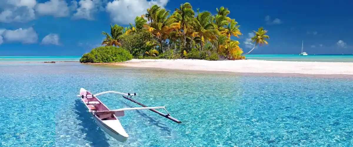 Fiji tropical beach with palm trees and crystal clear turquoise water