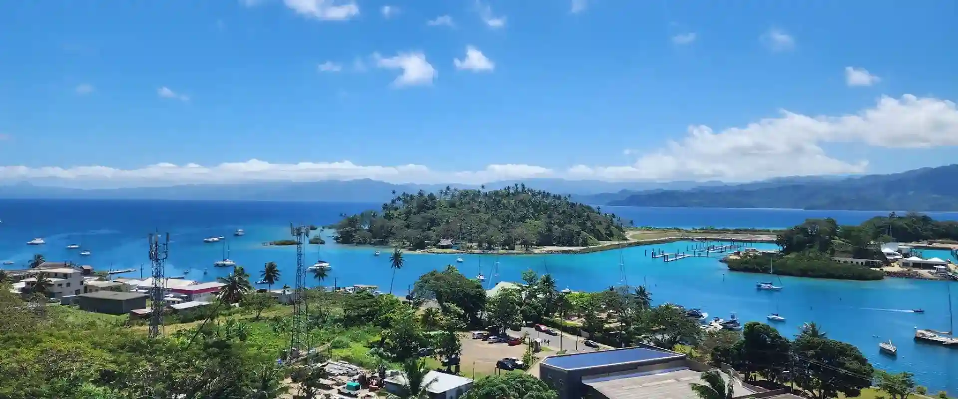 Savusavu Bay in Fiji with turquoise water, tropical hills, and peaceful eco-resorts