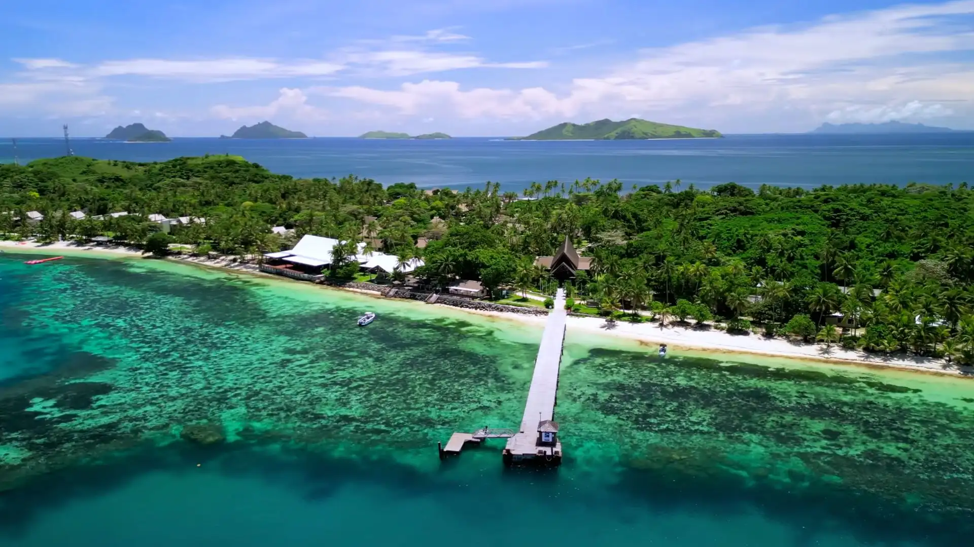 Aerial view of North Beach, Mana Island Fiji with white sand and turquoise lagoon