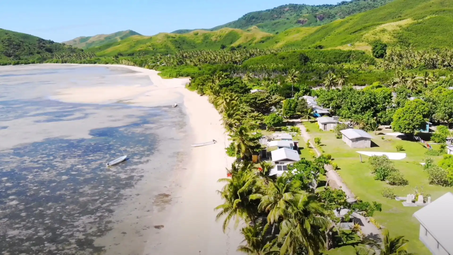 Stunning white sand beach with turquoise waters on Naviti Island in the Yasawa archipelago, Fiji