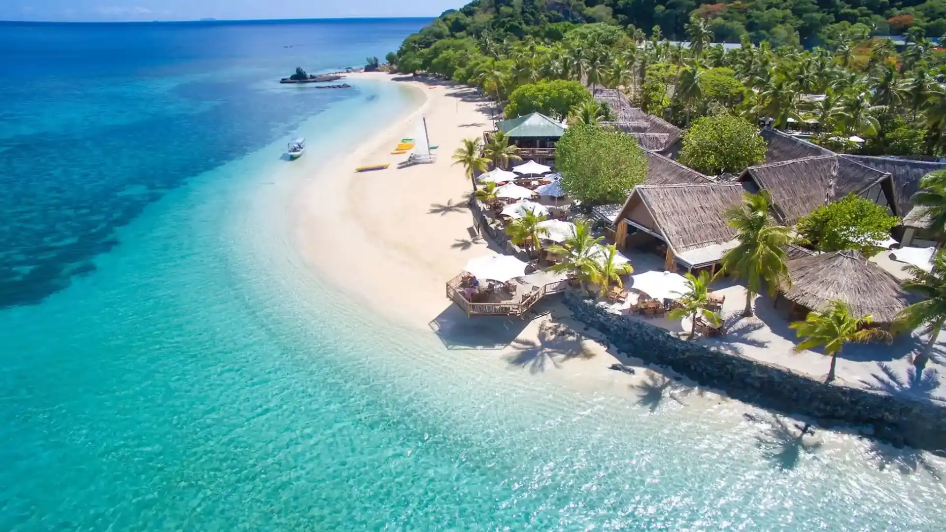 Aerial view of Qalito (Castaway) Island Beach with its iconic white sand beaches and surrounding coral reef