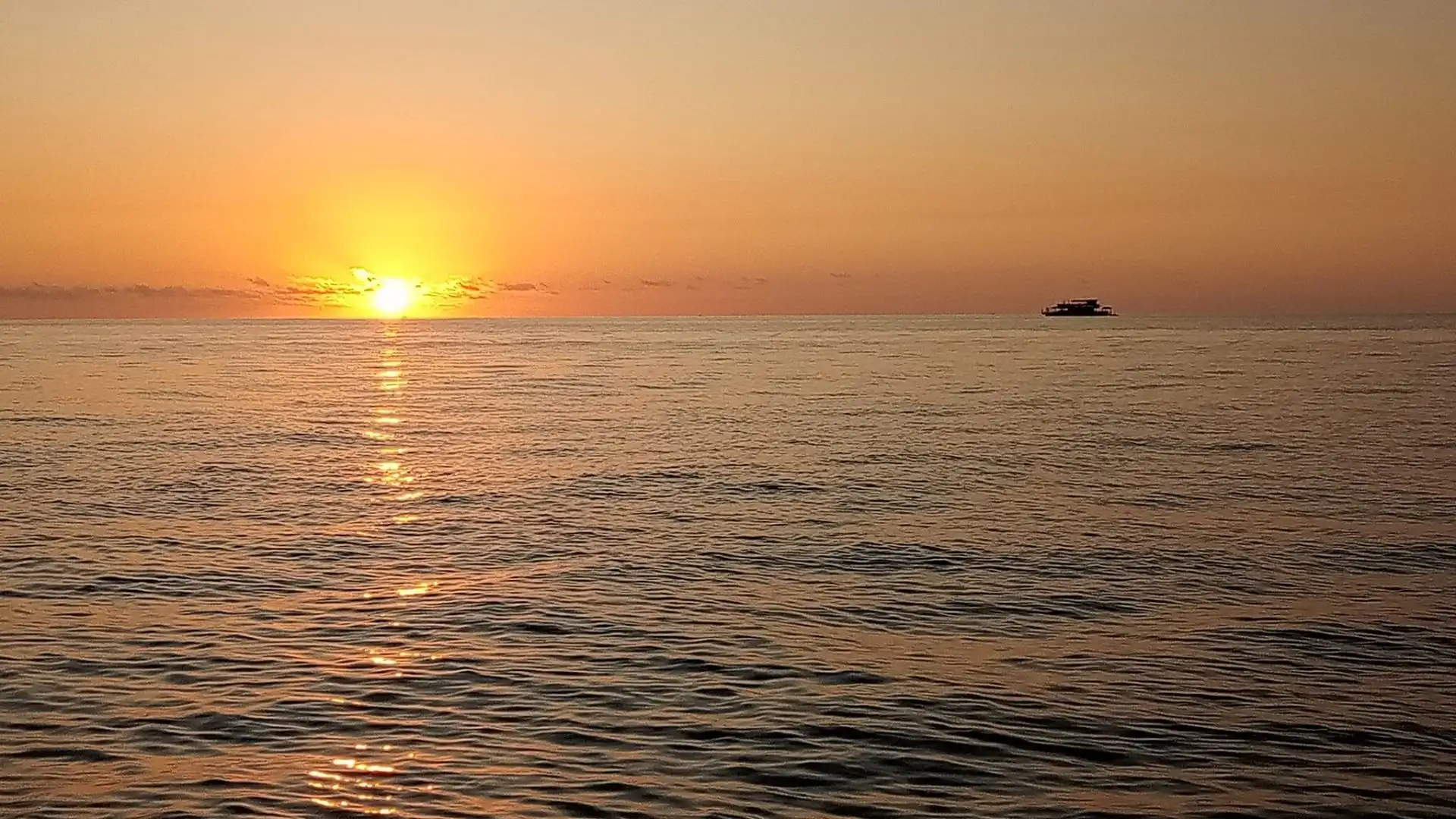 Stunning sunset at Sunset Beach, Malolo Lailai - golden hour over turquoise waters