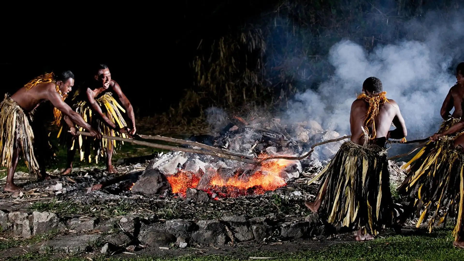 Sacred firewalking ceremony on Beqa Island with practitioners walking on glowing hot stones, Fiji