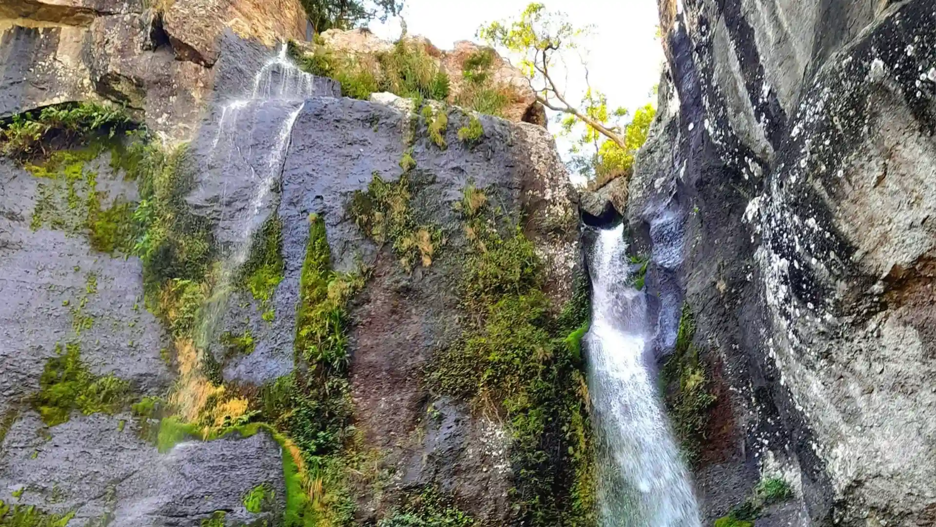 Mountain peaks and cloud forest landscapes at Koroyanitu National Heritage Park with traditional Fijian villages