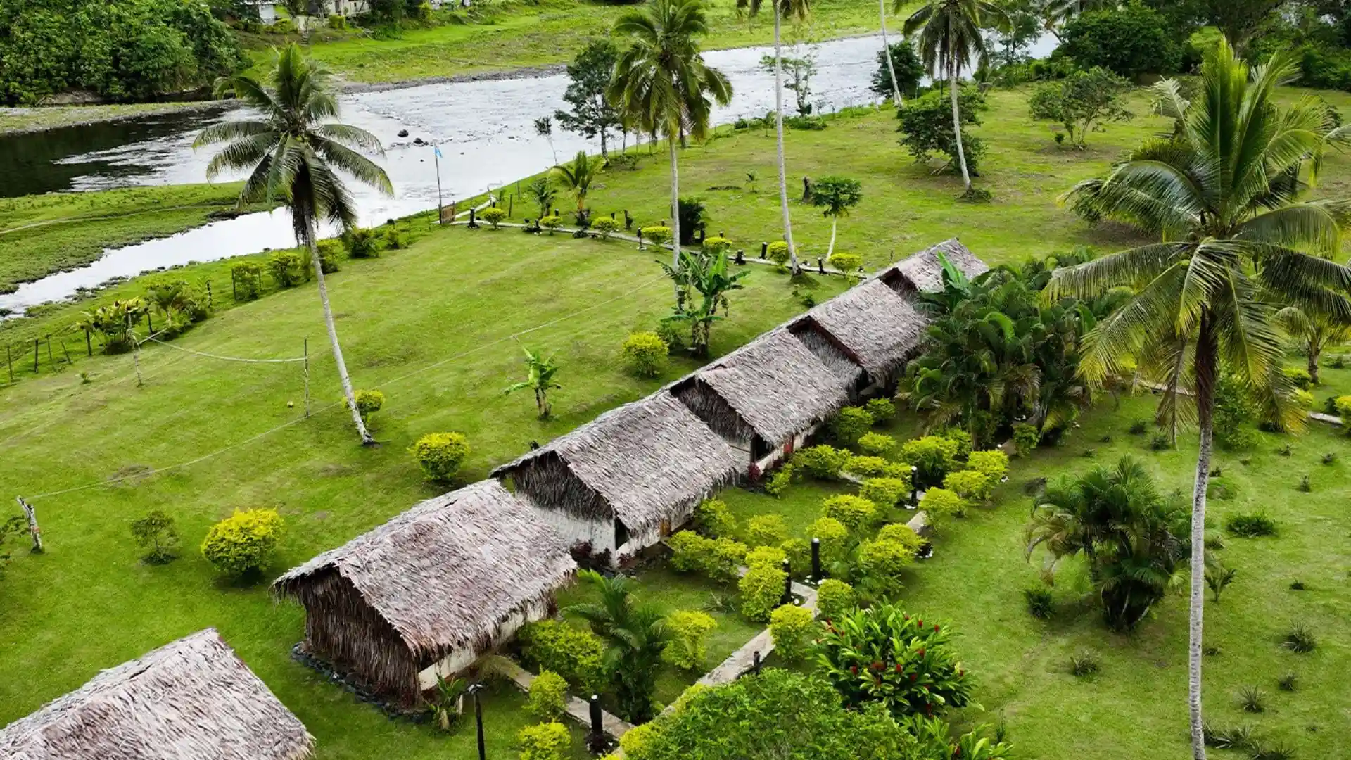 Lush rainforest canopy and traditional bures at Namosi Eco Retreat, Viti Levu